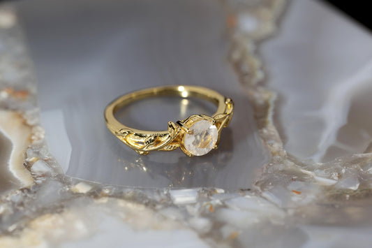 a close up of a ring on a marble surface