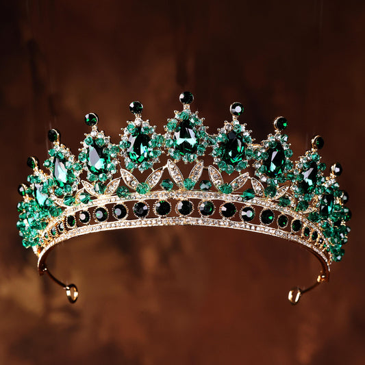 a tiara with a lot of green stones on it