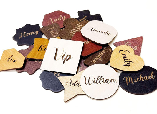 a collection of wooden name tags or coasters, each with a name written on it. The names include "Henry", "Vickie", "Amanda", "William", "Michael", and "Ava". The names are written in various styles and colors, creating a visually interesting and diverse display.
