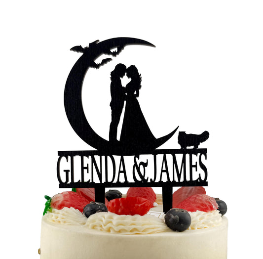 A silhouette of a bride and groom on a crescent moon, with the names 'Glenda & James' written below.