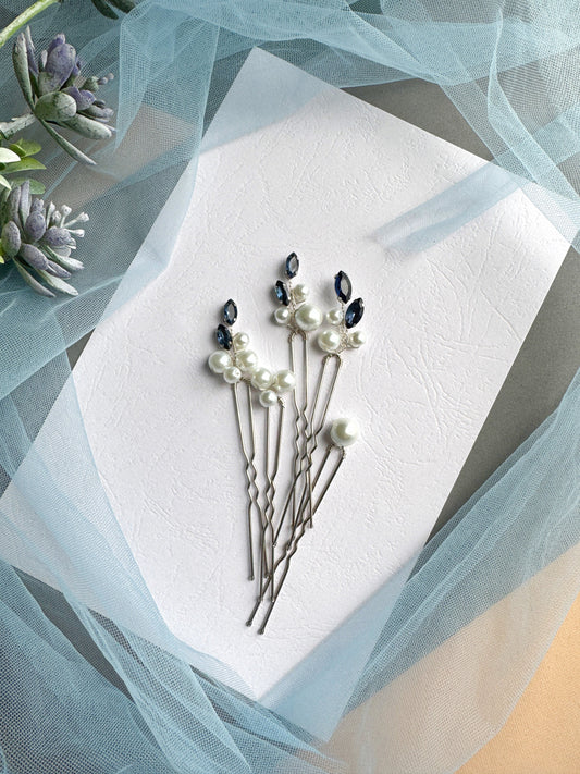a bunch of pins sitting on top of a piece of paper