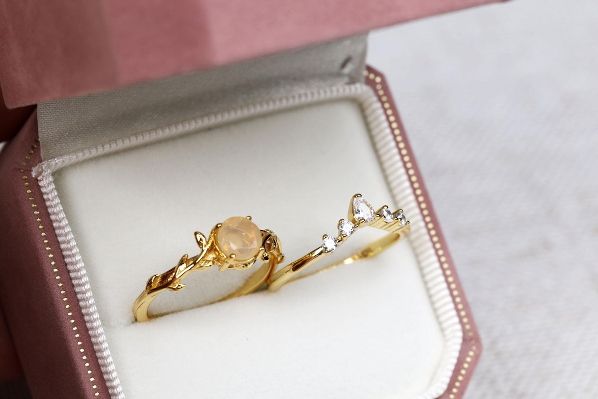 a couple of rings sitting inside of a box