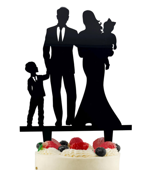 A silhouette of a family, including a man, a woman, and a child, is displayed on a cake topper.