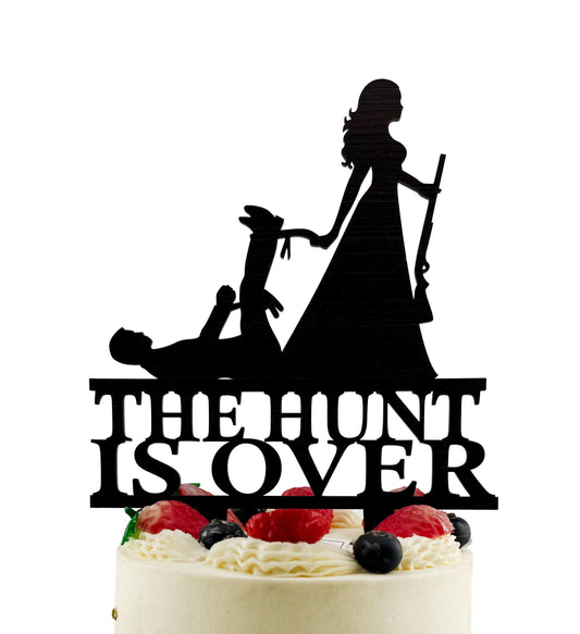 a silhouette of a woman holding a rifle, with the text "THE HUNT IS OVER" below the silhouette.