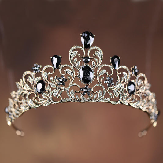 a tiara with black and white stones on it