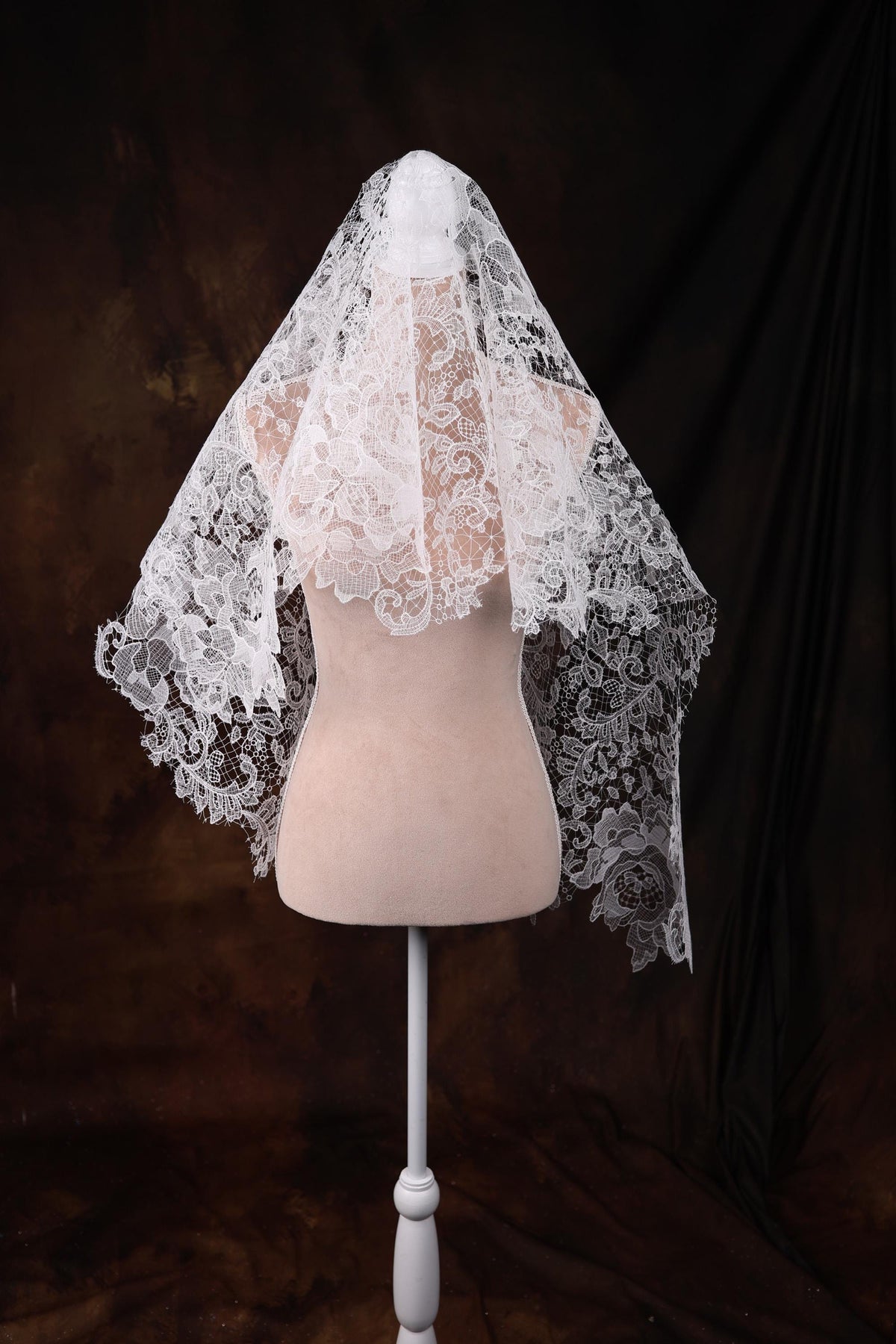 a mannequin with a veil on top of it