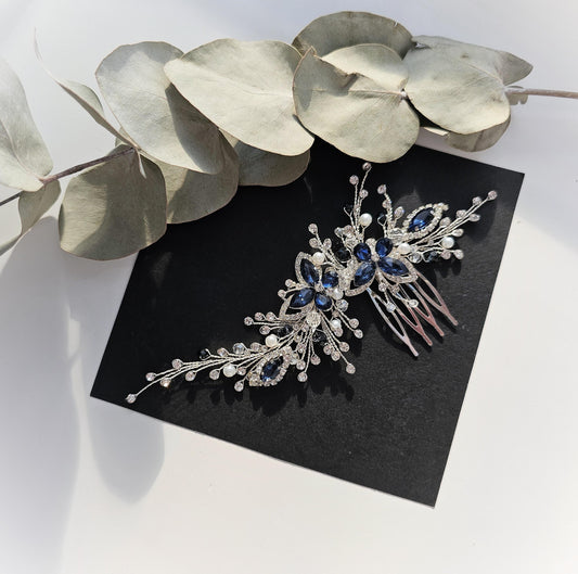 a close up of a brooch on a table