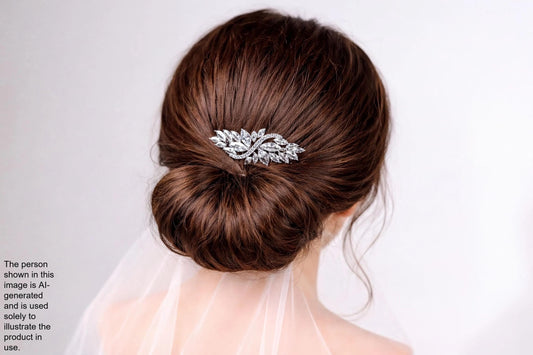 the back view of a woman's head, focusing on her hair and a decorative hair accessory.