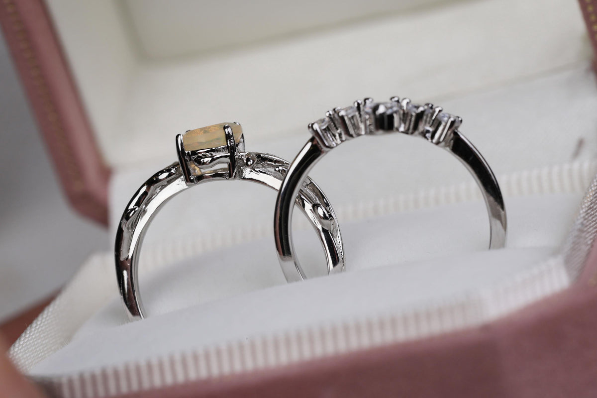 a couple of rings sitting inside of a box