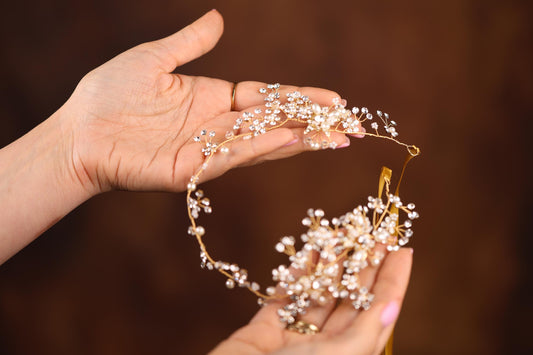 a person holding a piece of jewelry in their hand