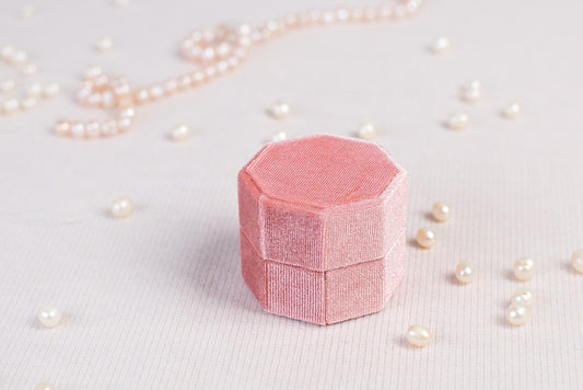 a piece of pink paper sitting on top of a table