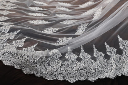 a close up of a wedding veil on a table
