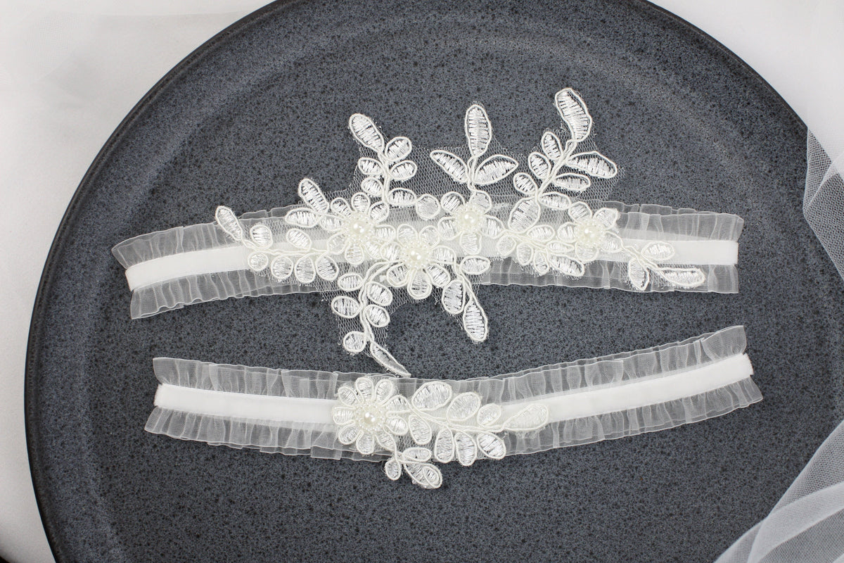 three wedding garters on a plate on a table