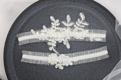 three wedding garters on a plate on a table