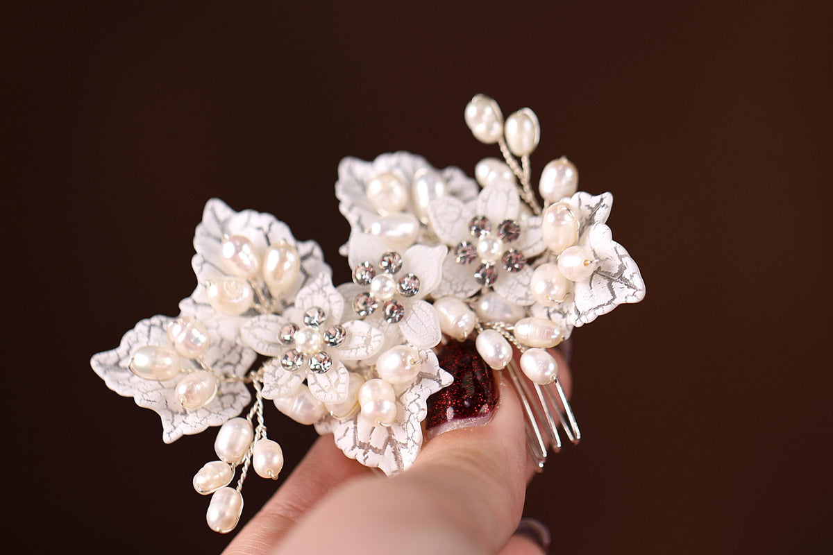 a close up of a person holding a hair comb