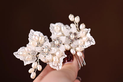 a close up of a person holding a hair comb