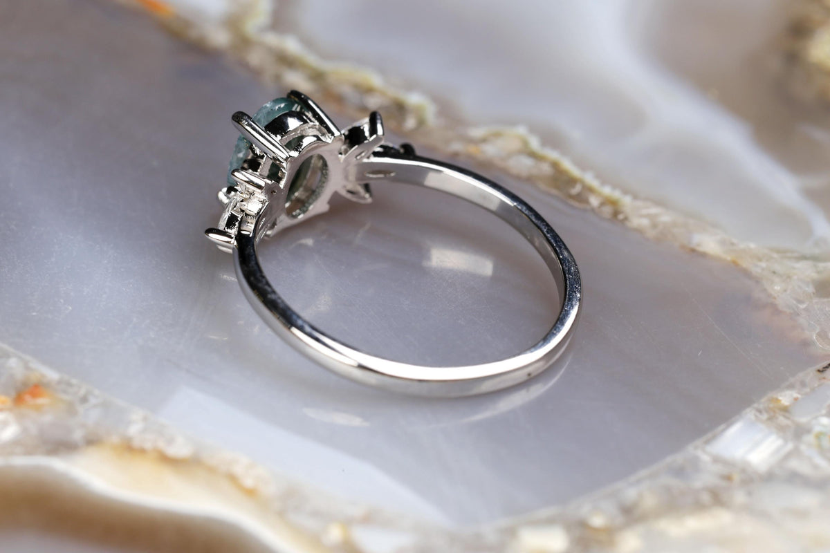 a close up of a ring on a rock