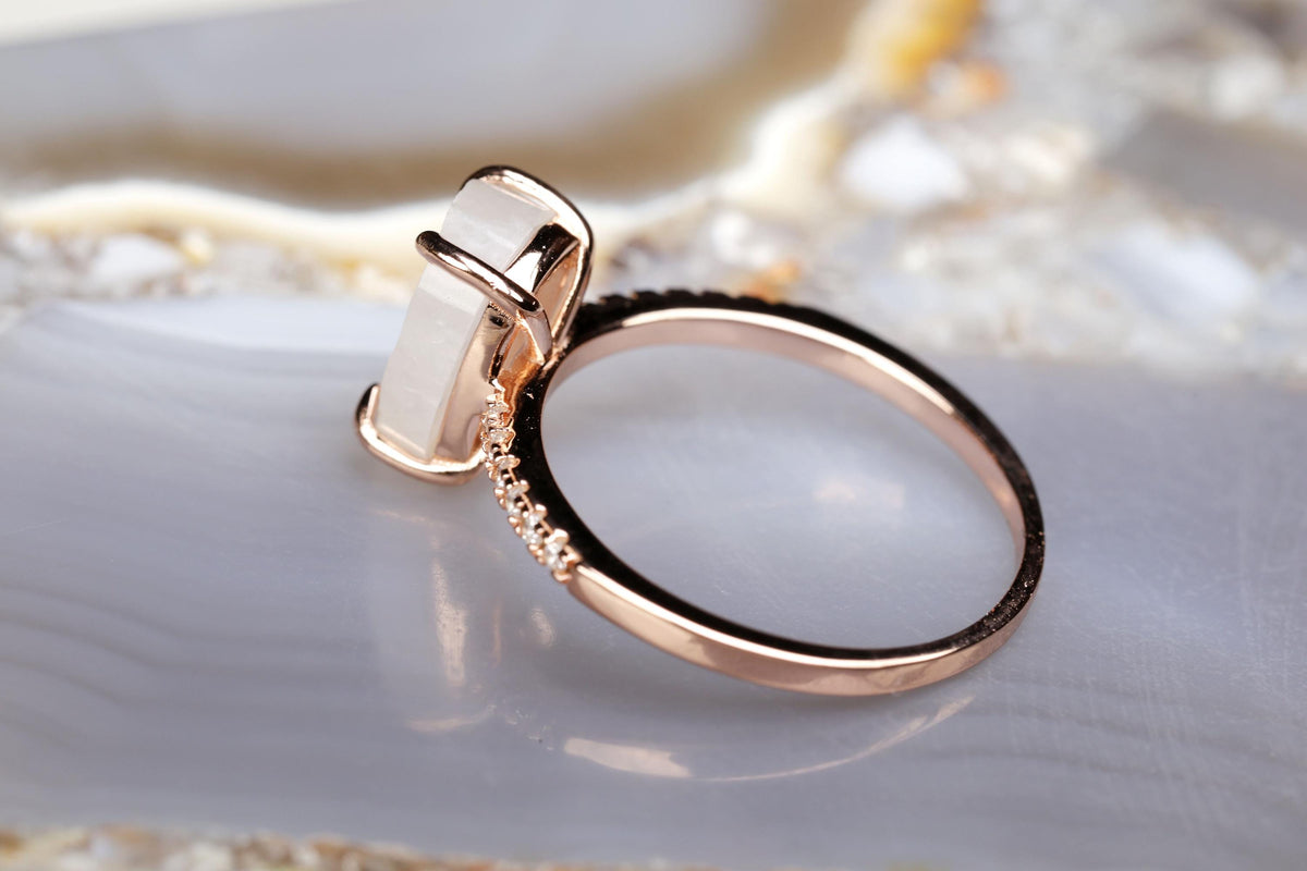 a close up of a ring on a rock