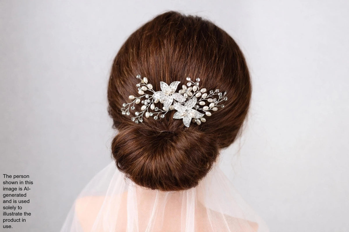 the back view of a woman's head with a decorative hair accessory, which appears to be a floral or crystal-like piece.