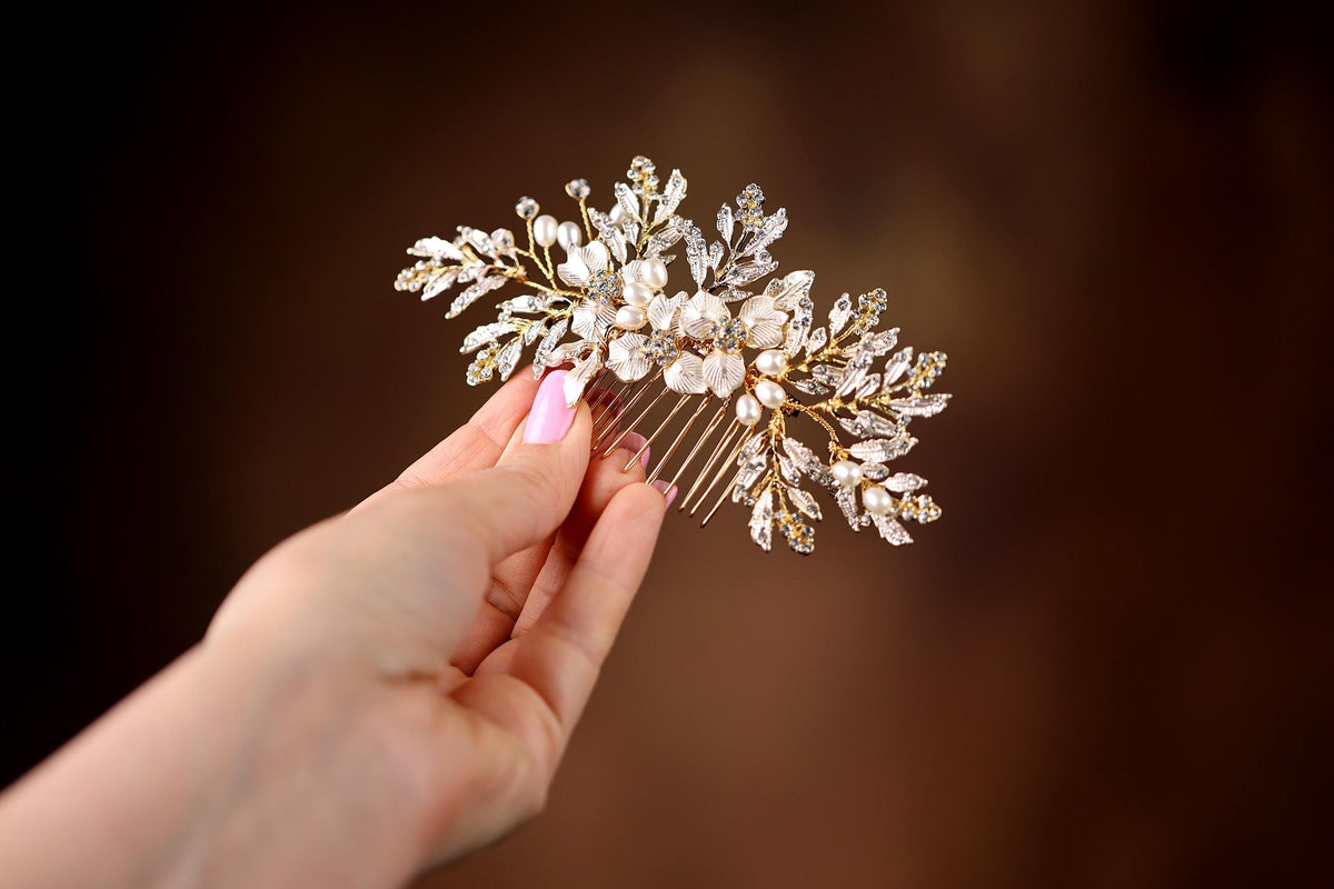 a woman holding a hair comb in her hand