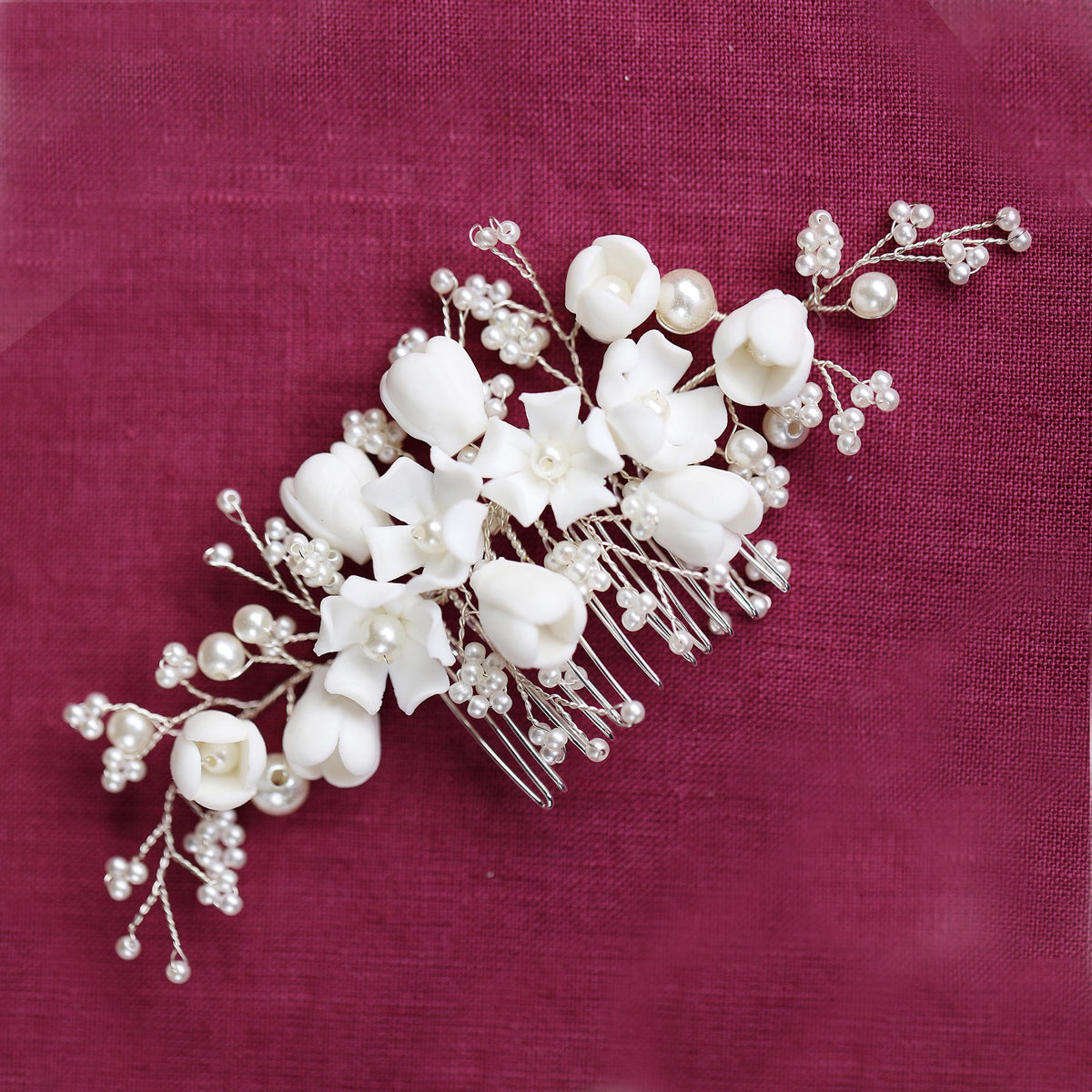 a bridal hair comb with white flowers and pearls