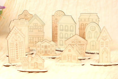 a collection of wooden houses or buildings, each with unique architectural designs and details, arranged on a surface.