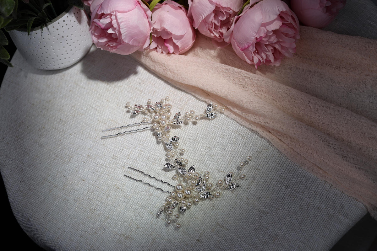 a bouquet of pink flowers sitting on top of a table
