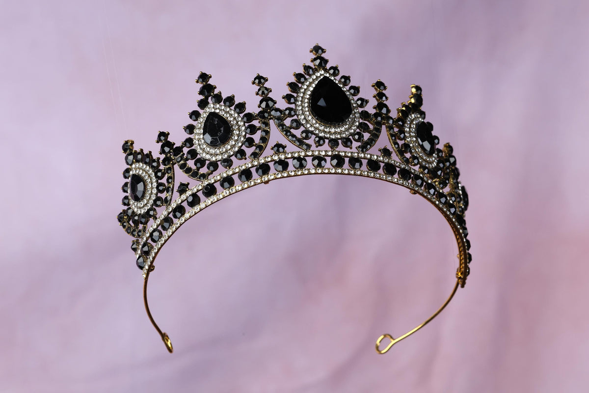 a tiara with black stones on it