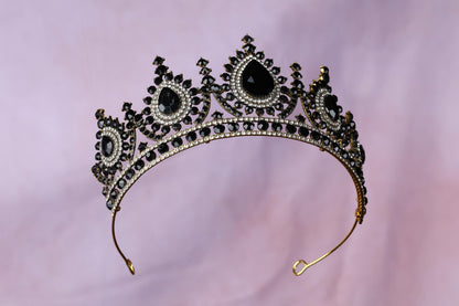 a tiara with black stones on it