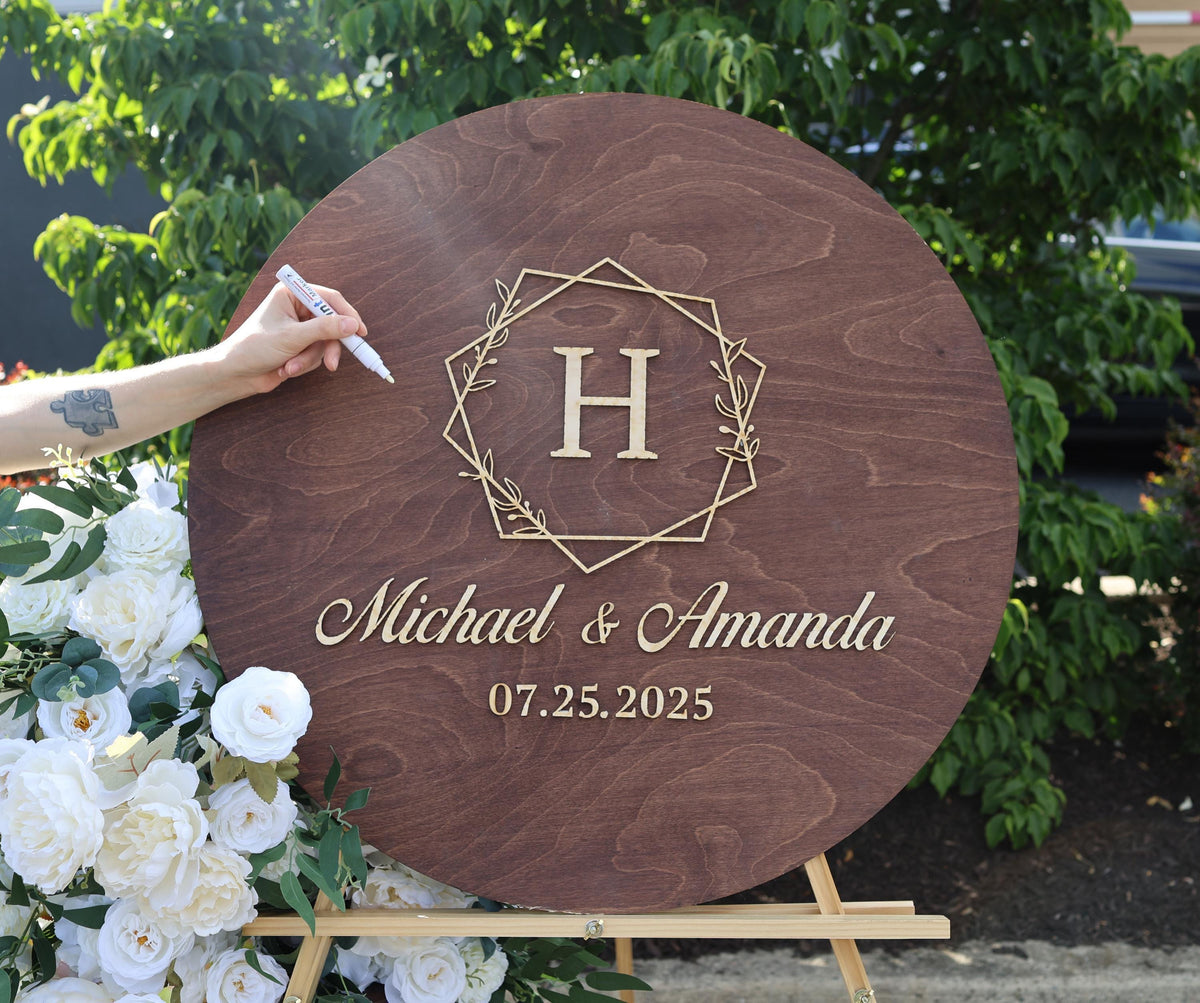 a person is writing on a wooden sign