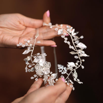a close up of a person holding a piece of jewelry