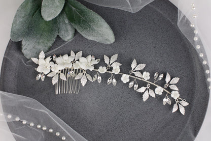 a bridal hair comb with white flowers and leaves