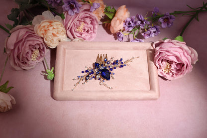 a plate with a hair comb and flowers on it