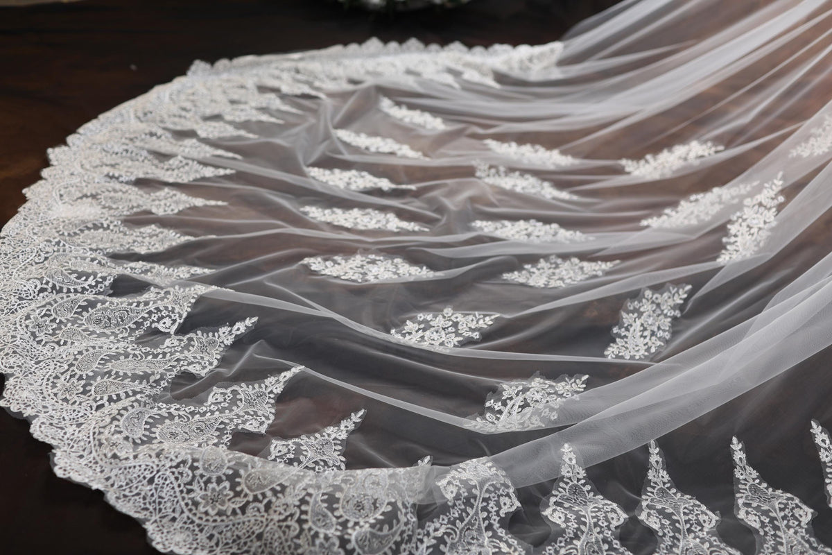 a close up of a wedding veil on a table