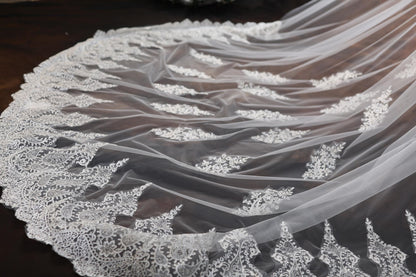 a close up of a wedding veil on a table
