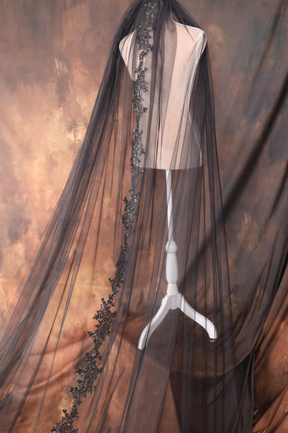 a dress on a mannequin with a veil over it