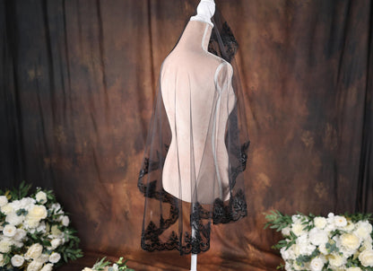 a dress on a mannequin with flowers in the background