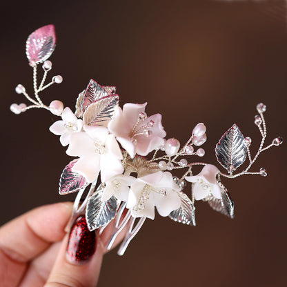 a person holding a flower and a hair comb