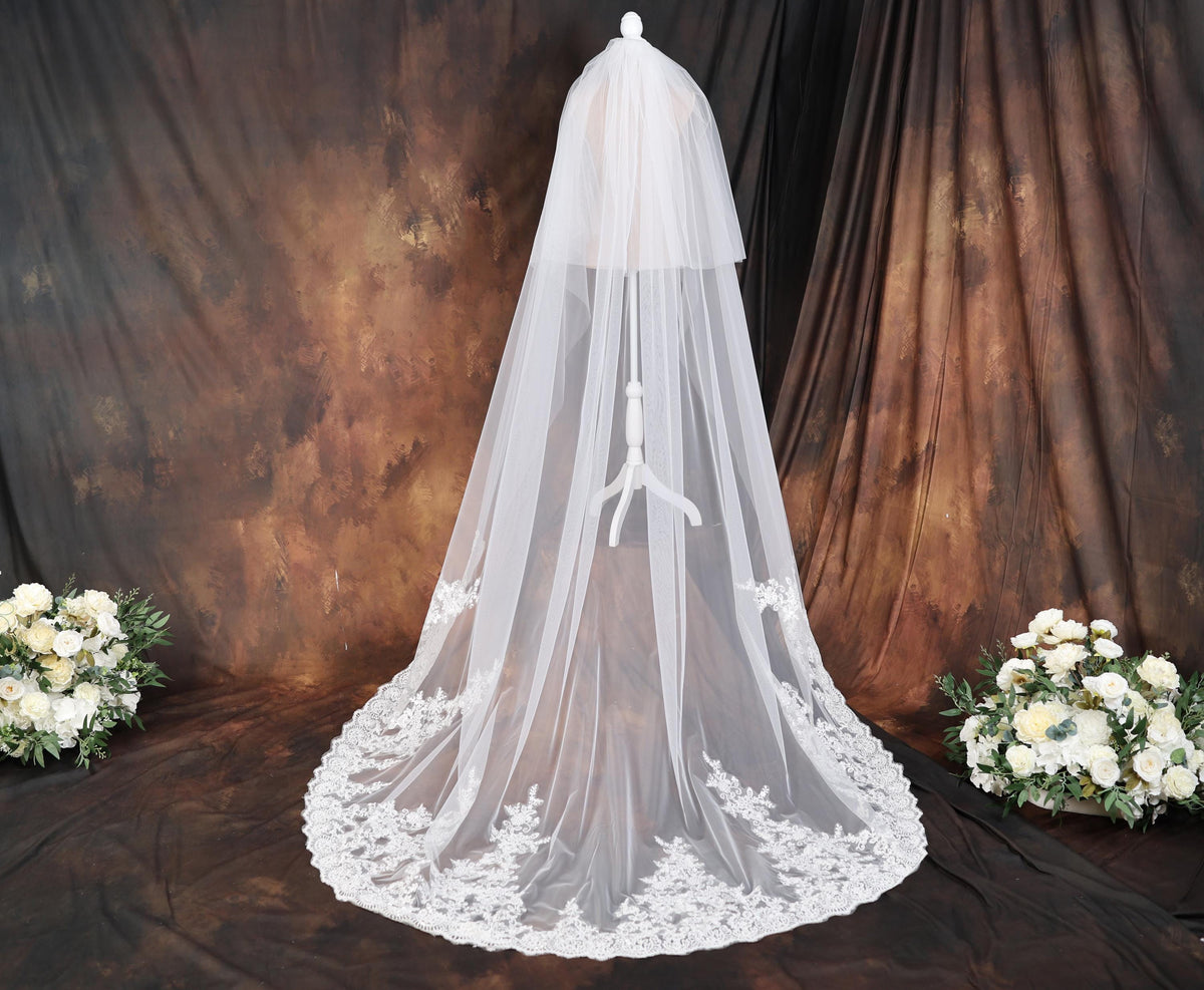 a bridal veil with a bouquet of white flowers