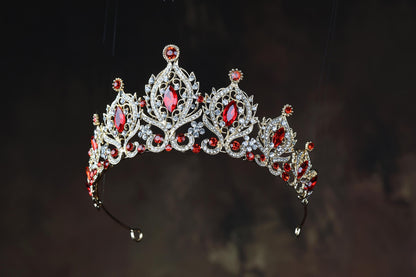 a tiara with red and white stones on it