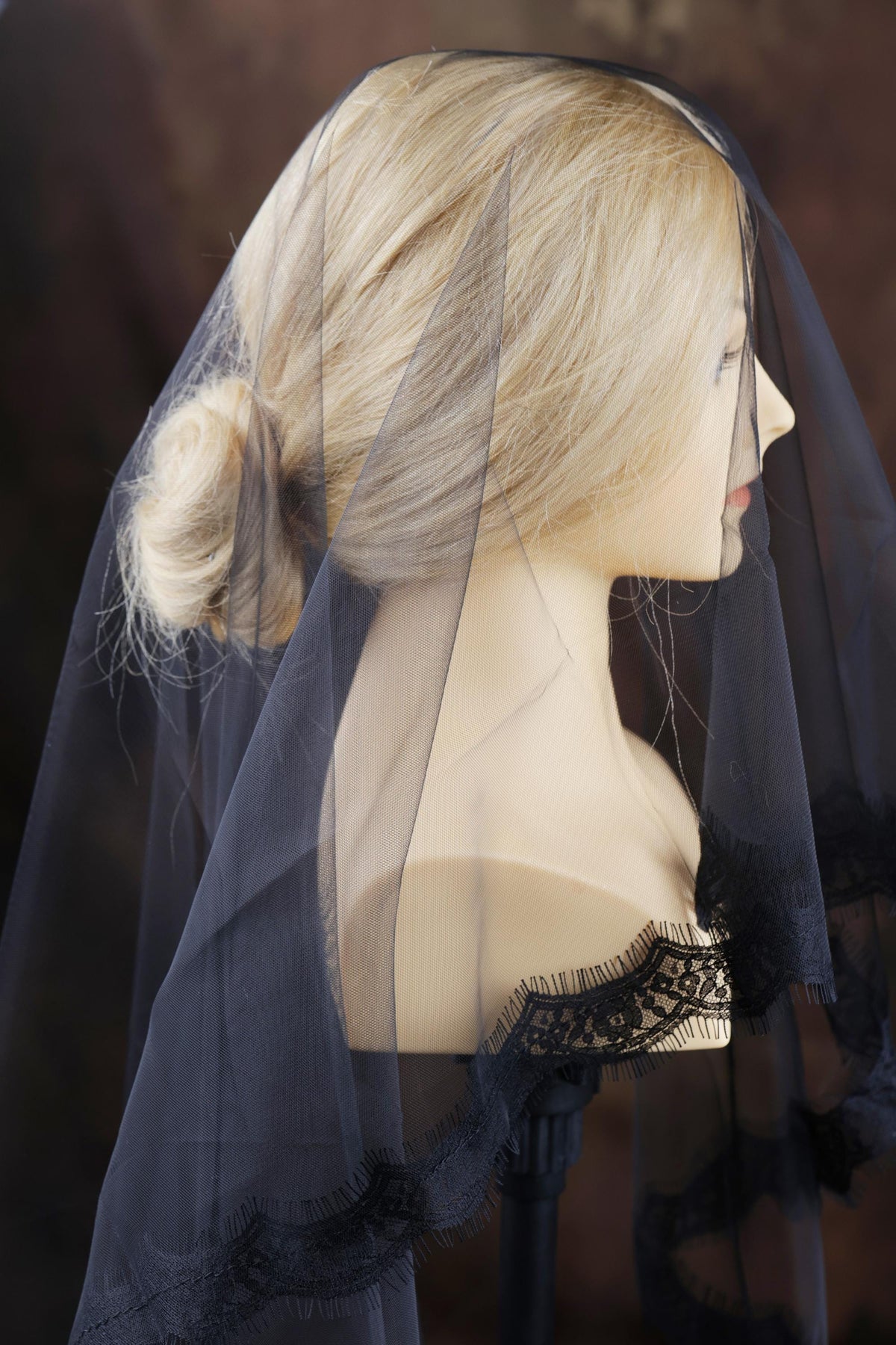 a mannequin with a veil on it's head