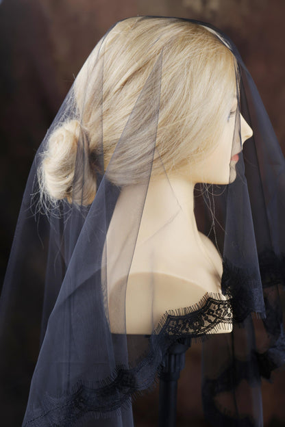 a mannequin with a veil on it's head