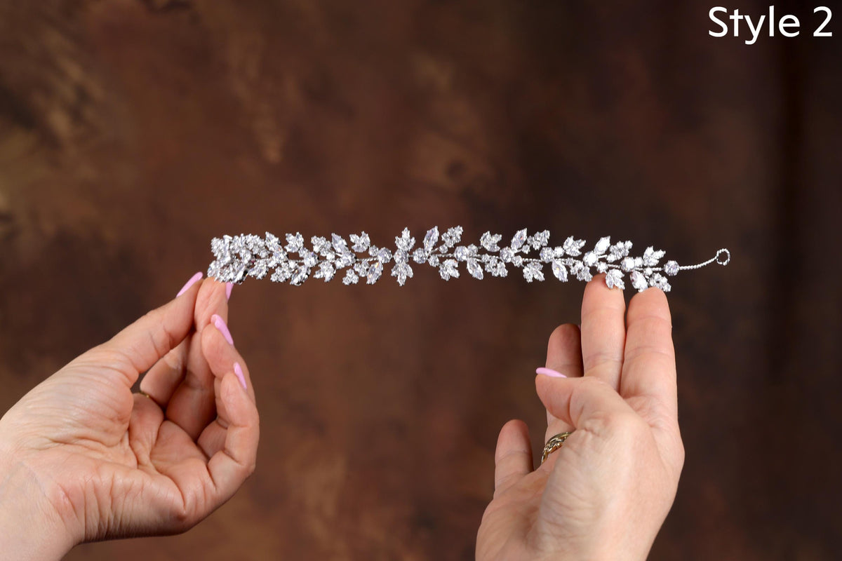 a woman holding a tiara in her hands