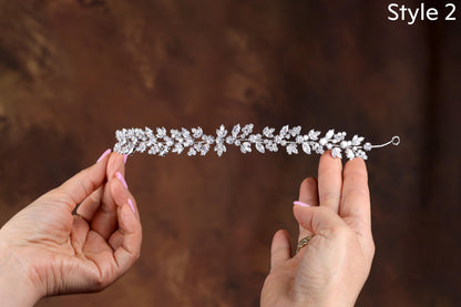 a woman holding a tiara in her hands