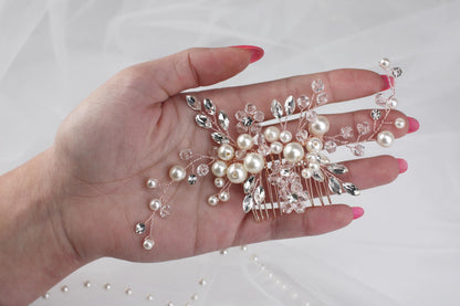 a woman's hand holding a bunch of pearls