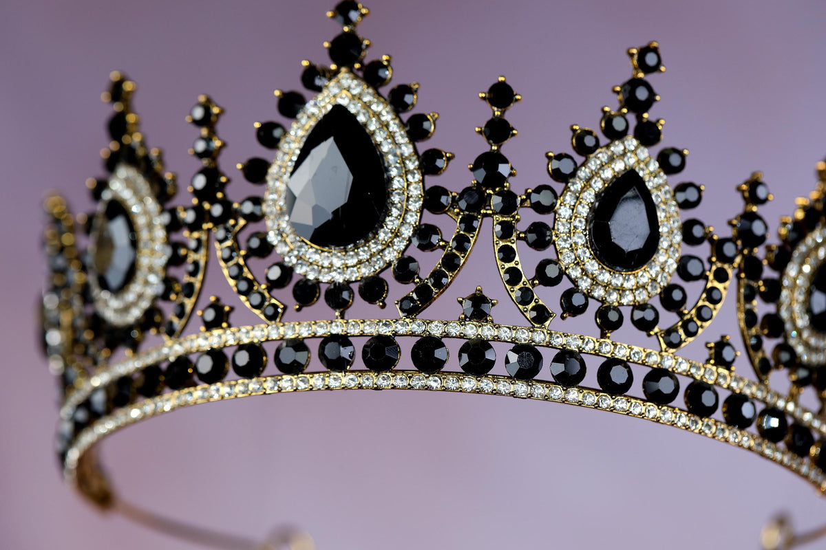 a tiara with a lot of black stones on it