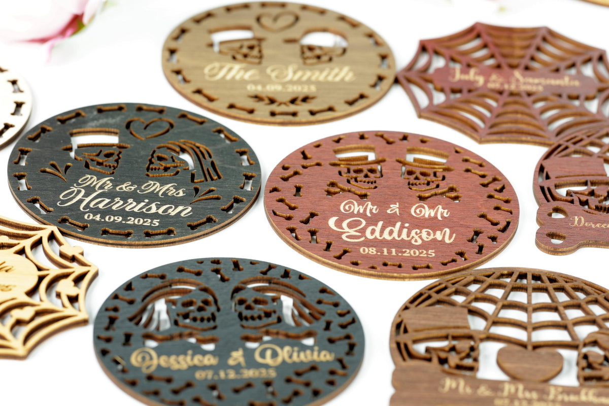 a collection of wooden coasters or magnets with various designs, including skull motifs and text.