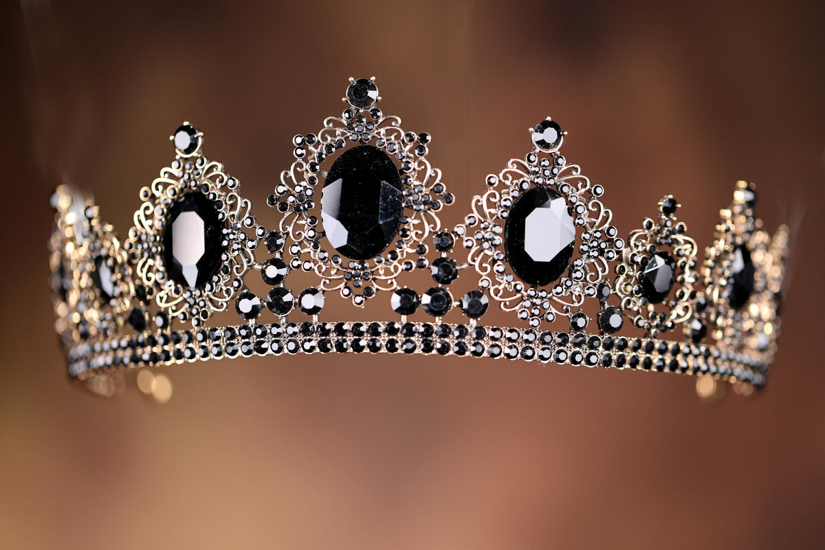a black and white tiara on a brown background