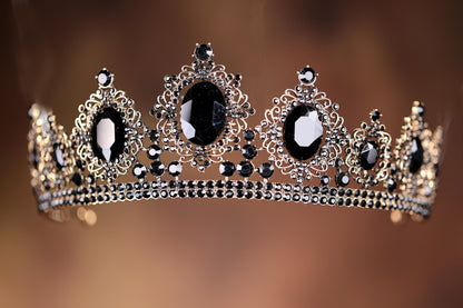 a black and white tiara on a brown background