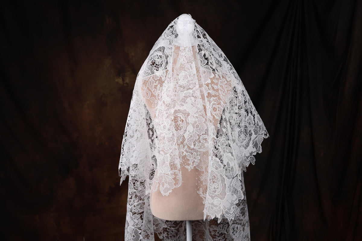 a white veil on a mannequin head
